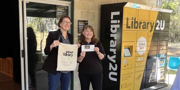 Two library patrons standing in front of a remoteLocker™ unit at Blue Mountains Library, AUS, celebrating expanded access to rural communities.